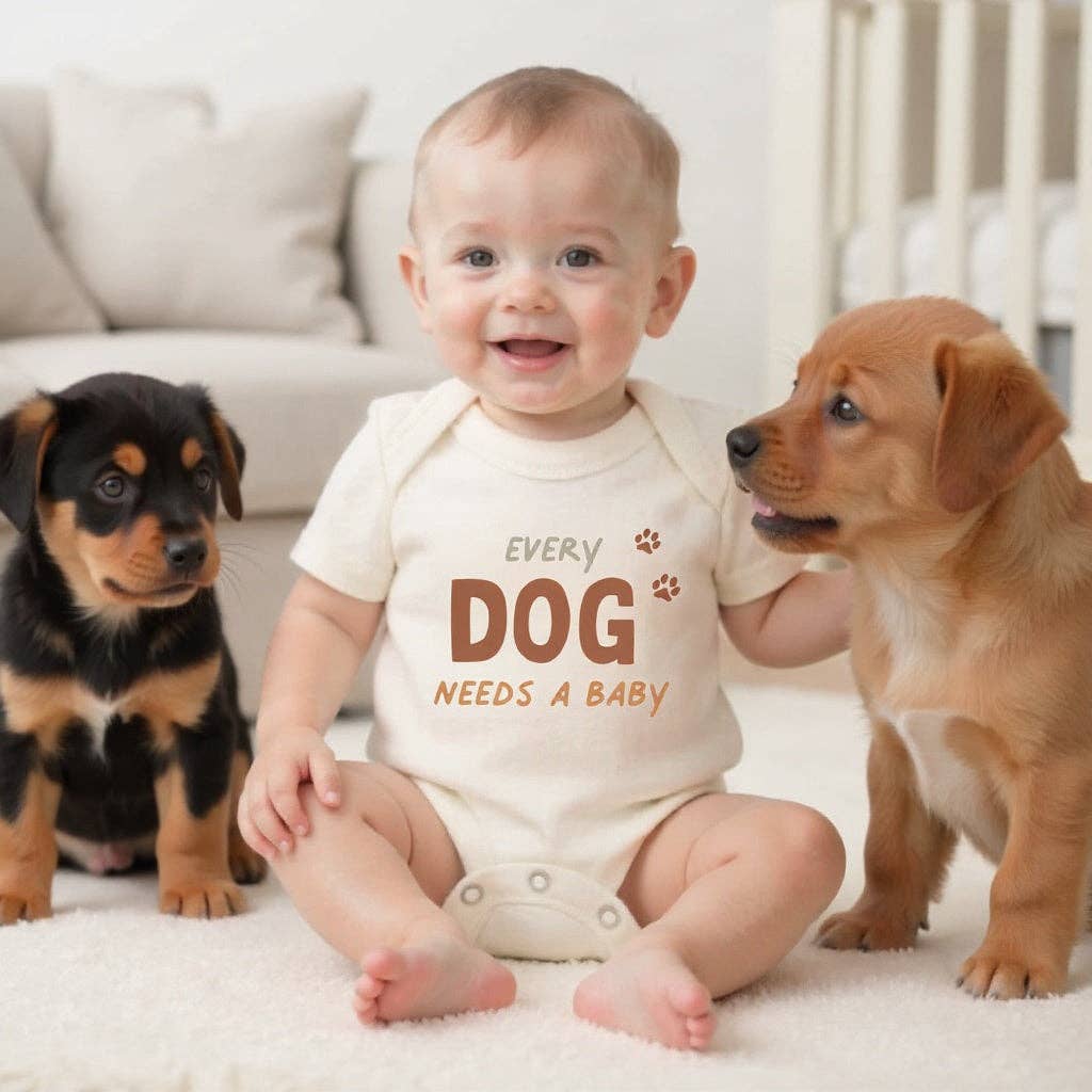 “Every Dog Needs a Baby” Organic Cotton Baby Bodysuit